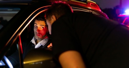 police stopping a driver on the road
